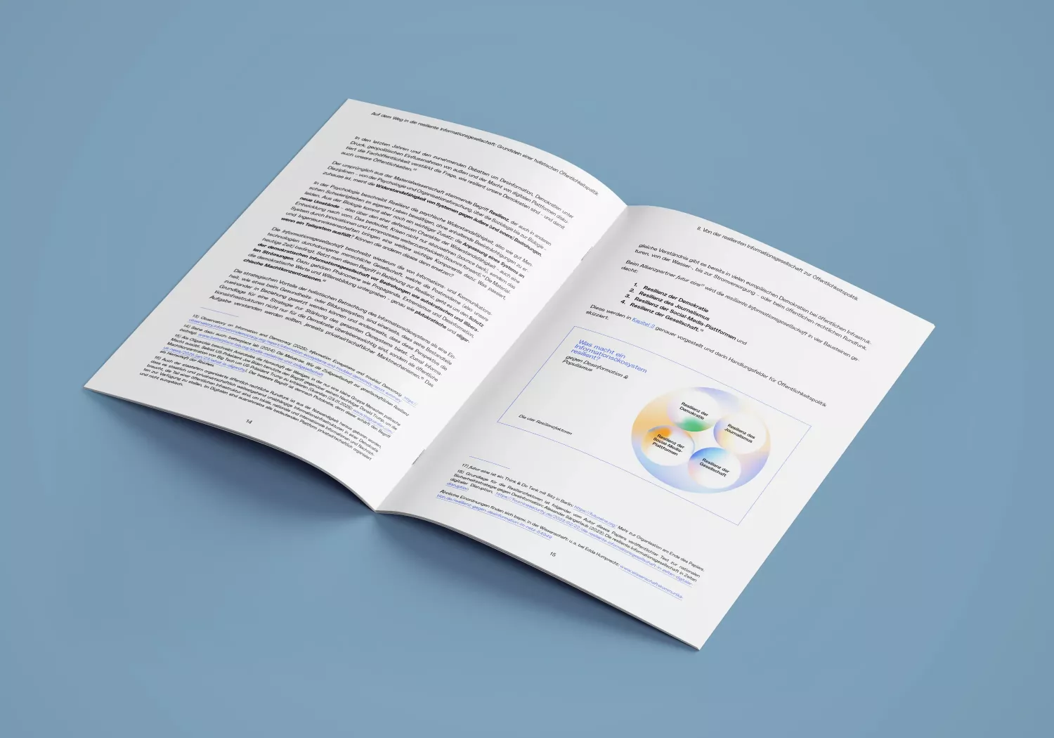 Open brochure on blue background, left page with continuous text, right page with text and color gradient circles in blue, orange, green, and white