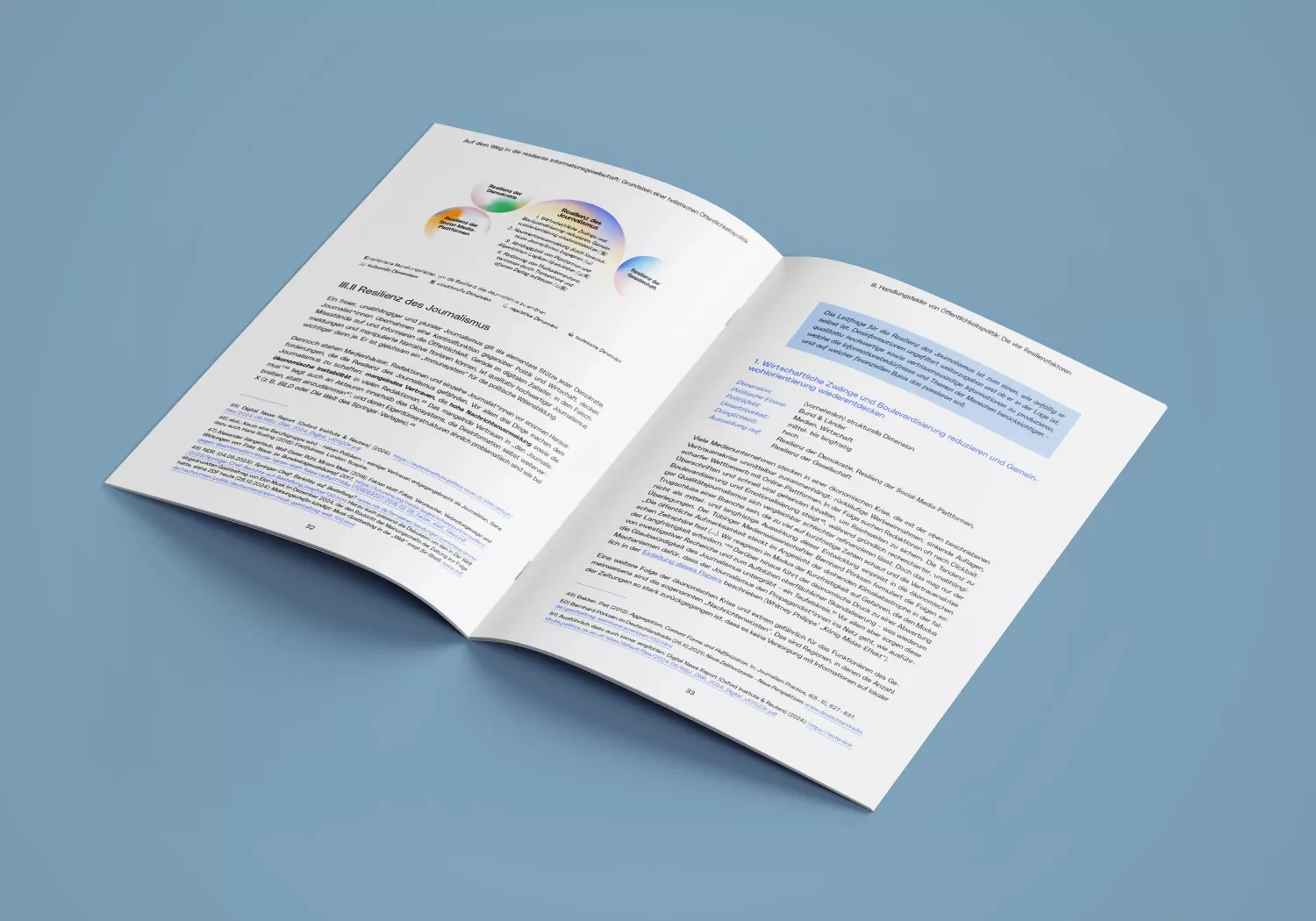 Open brochure on blue background, left page with text and gradient circles in blue, organs, green, and white, right page with continuous text