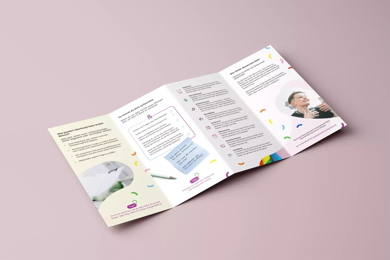 Opened Queermed flyer on a pink background, with text, illustrations, and a photo of a smiling person on the right-hand side